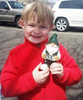 Youngster holds a Clean Up KiRBy doll